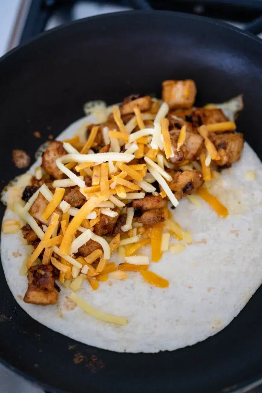 Chicken Quesadillas in pan with fillings Open and layered with cheese