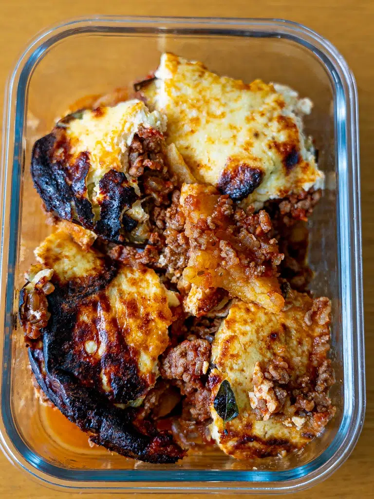 Freezer-friendly moussaka neatly packed in containers for easy meal prep.