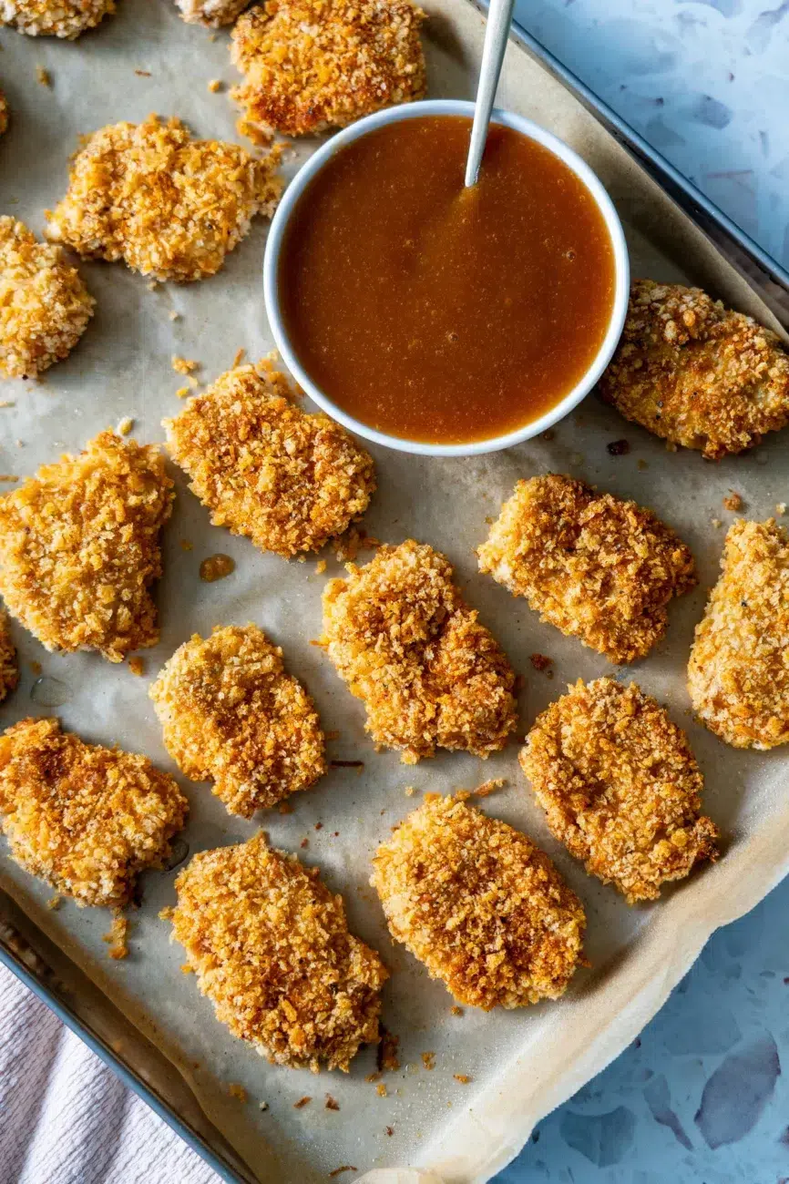 Freshly Baked Nuggets on Tray with Sweet and Sour Sauce