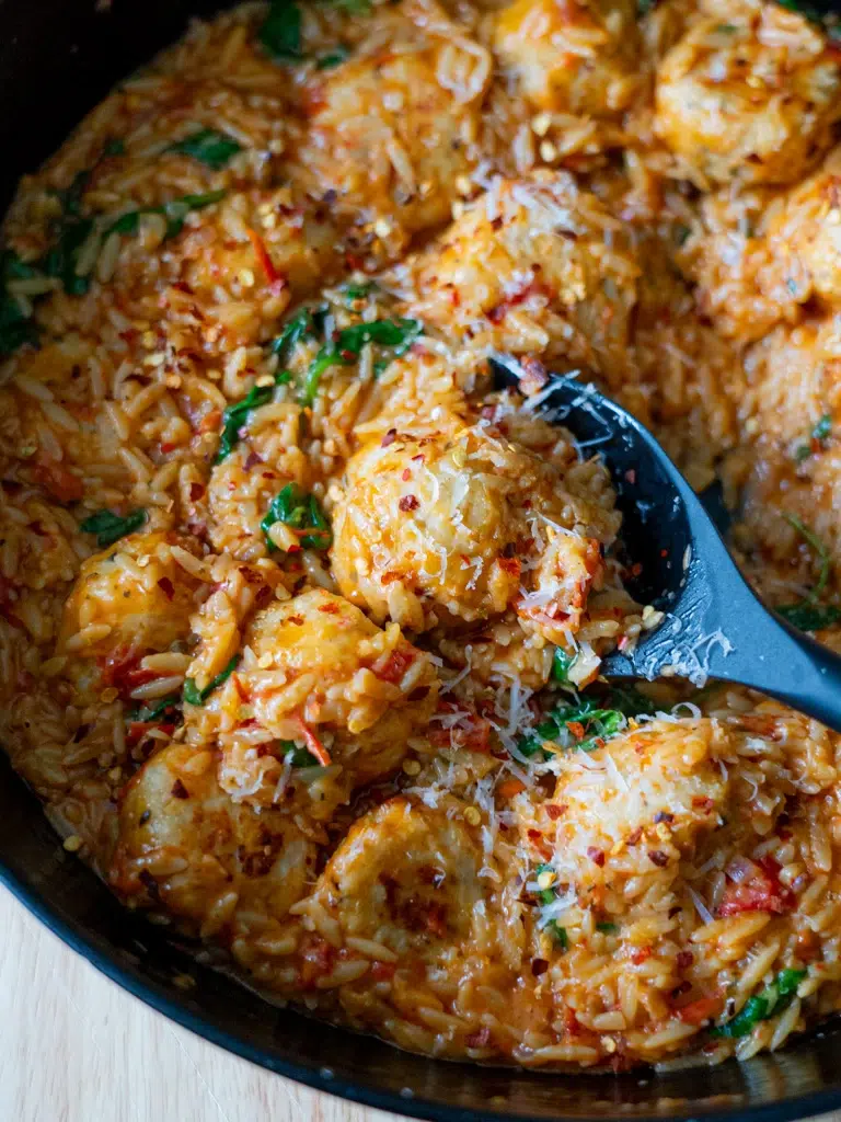 Overhead shot of Marry Me Chicken Meatballs with risoni (orzo) in a creamy, golden sauce.