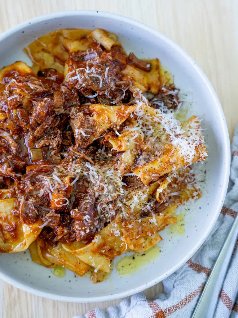 Warm and comforting slow cooker beef ragu with a rich, deep color.