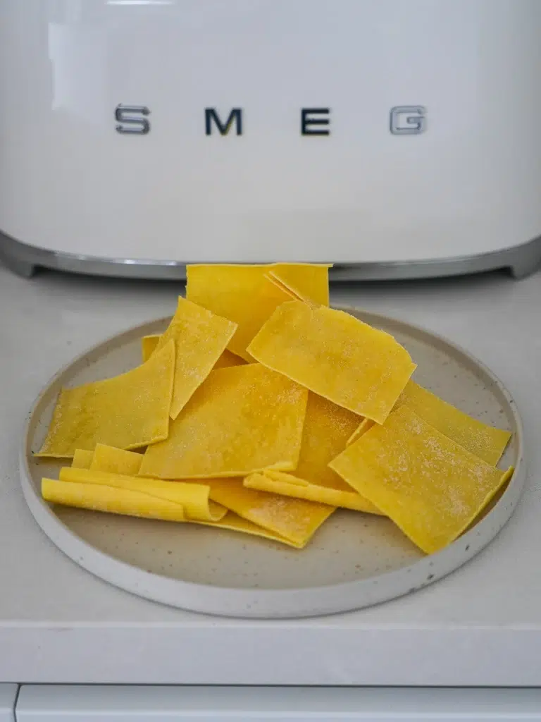 Fresh lasange sheets cut up into smaller pieces.